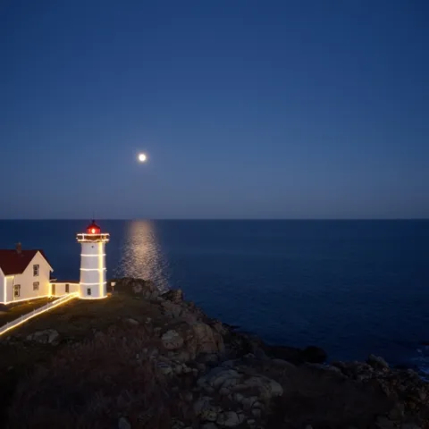 A lighthouse by the sea at night